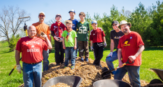 A group of scouts with scoutmasters