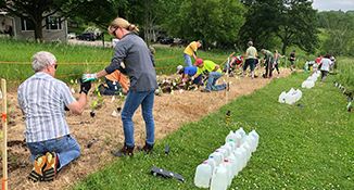 A group of volunteers at Stewart Lake County Park installing a native plant garden