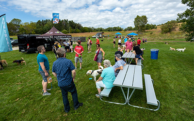 people gathered around a picnic table