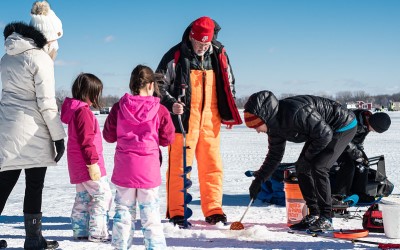 group of people learning about ice fishing