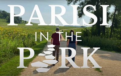 Parisi in the Park text over two people walking on a trail